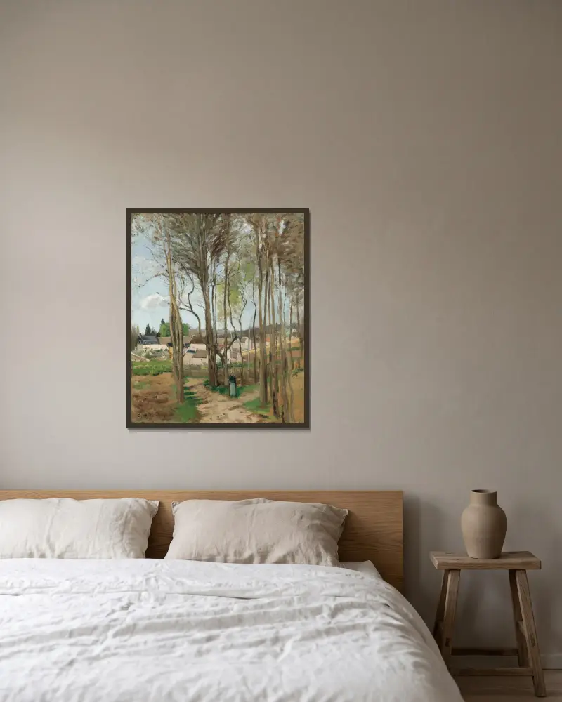Byn genom träden av Camille Pissarro inramad på en vägg