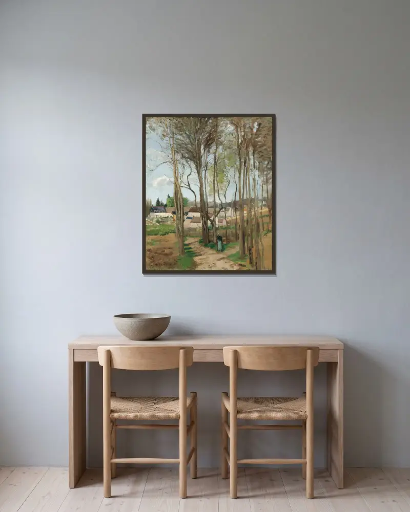 Byn genom träden av Camille Pissarro inramad på en vägg