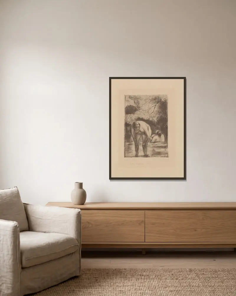 Les deux baigneuses av Camille Pissarro inramad på en vägg
