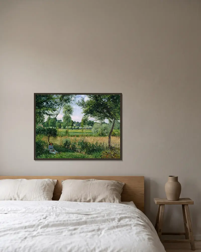 Morgonljus i Eragny av Camille Pissarro inramad på en vägg