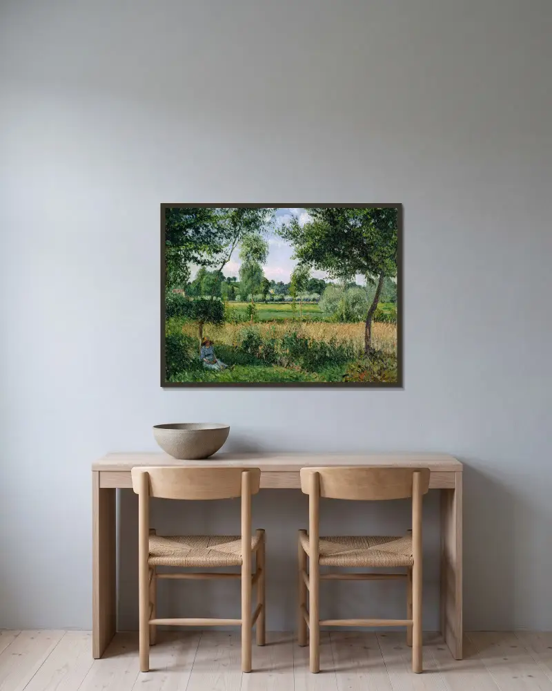 Morgonljus i Eragny av Camille Pissarro inramad på en vägg