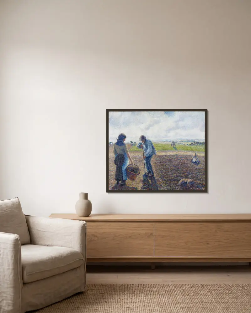 Bönder på fälten, Éragny av Camille Pissarro inramad på en vägg