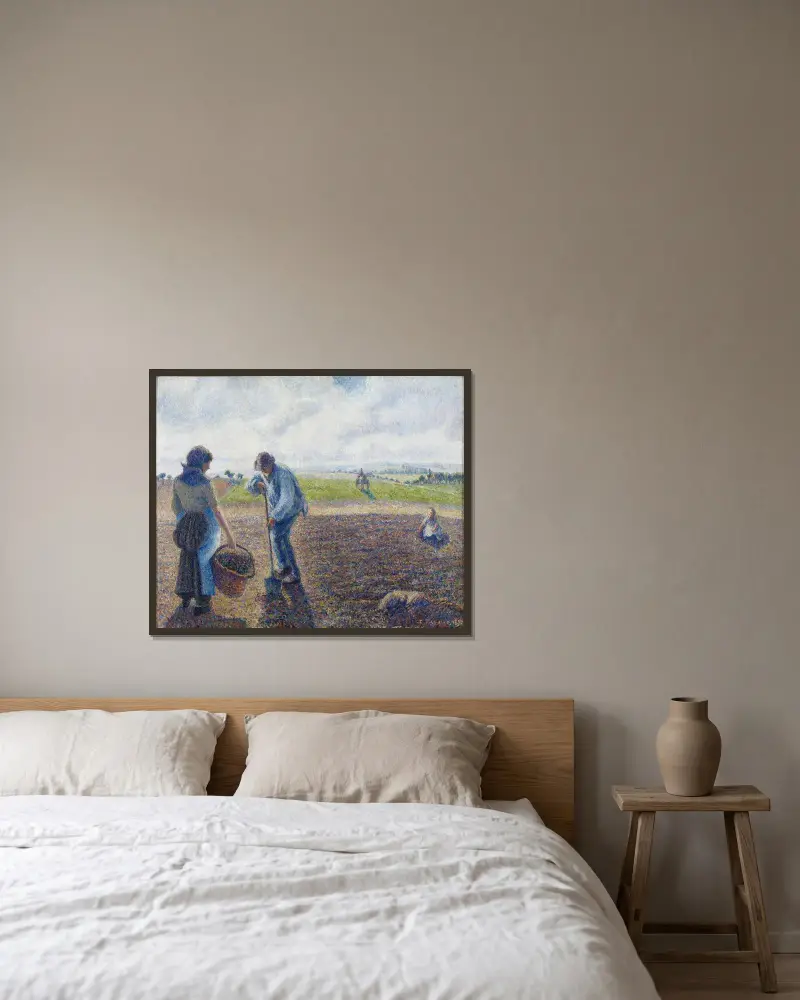 Bönder på fälten, Éragny av Camille Pissarro inramad på en vägg