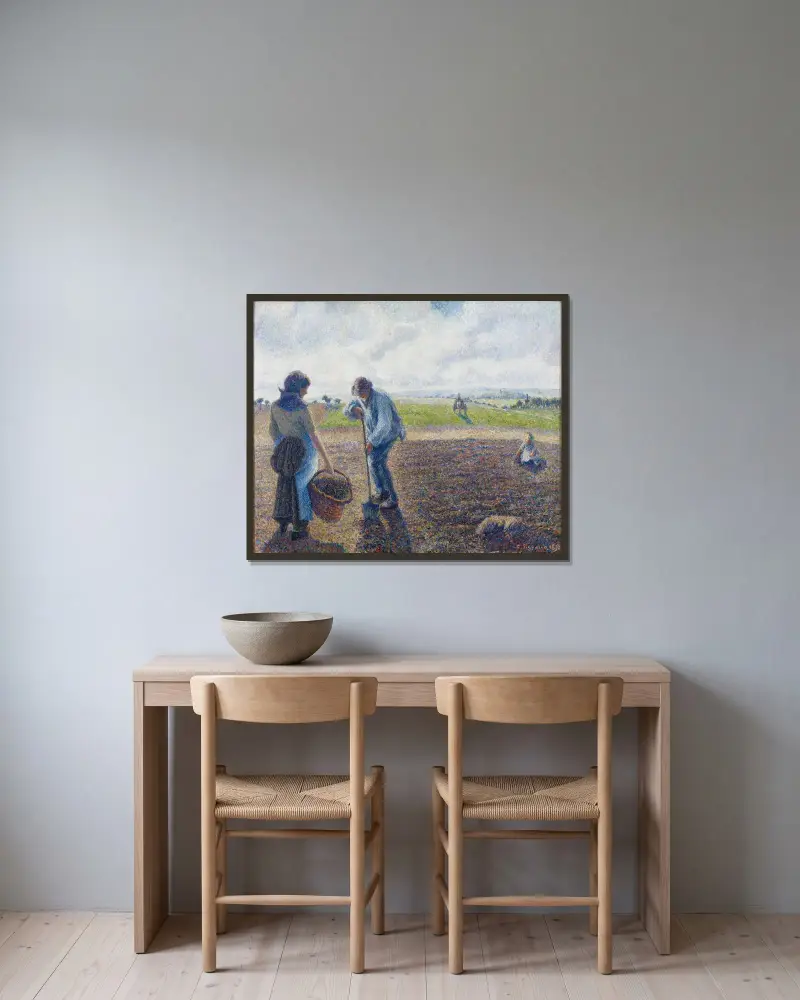 Bönder på fälten, Éragny av Camille Pissarro inramad på en vägg