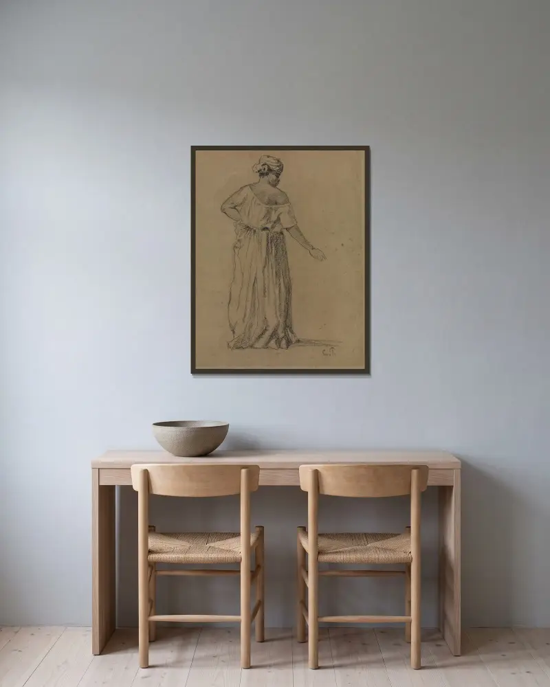 Svart kvinna med turban och lång klänning, bakifrån av Camille Pissarro inramad på en vägg