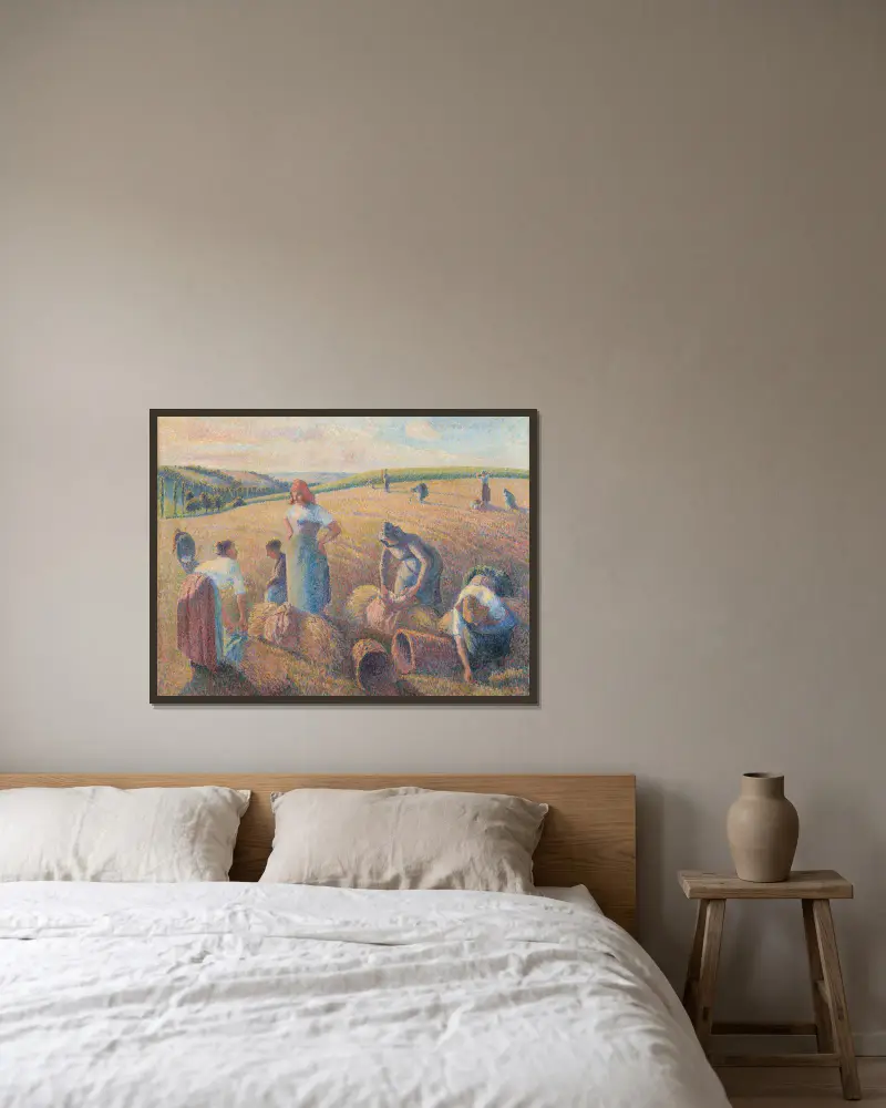 The Gleaners av Camille Pissarro inramad på en vägg