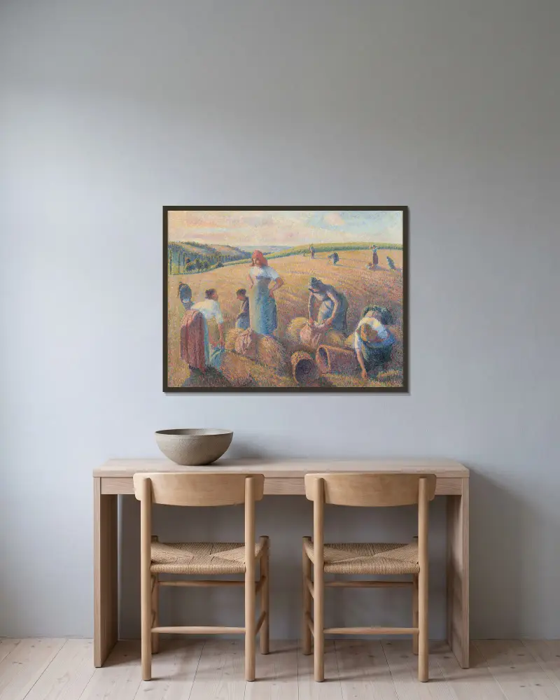 The Gleaners av Camille Pissarro inramad på en vägg