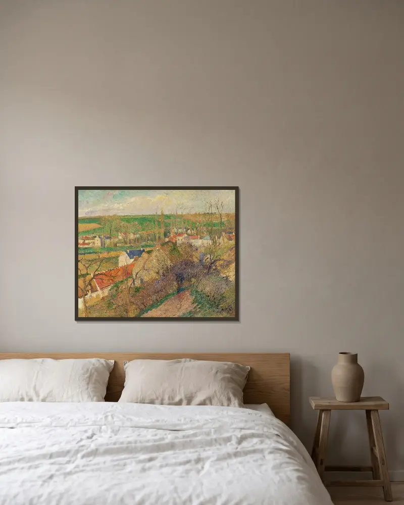 Vy över byn Osny av Camille Pissarro inramad på en vägg