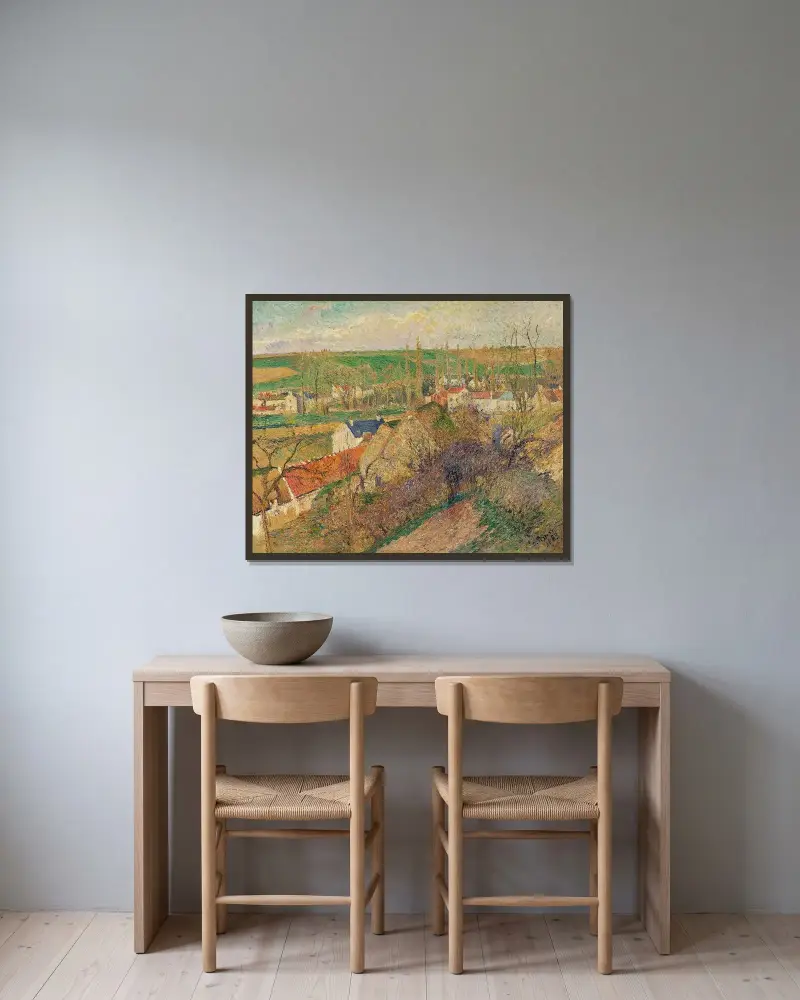 Vy över byn Osny av Camille Pissarro inramad på en vägg