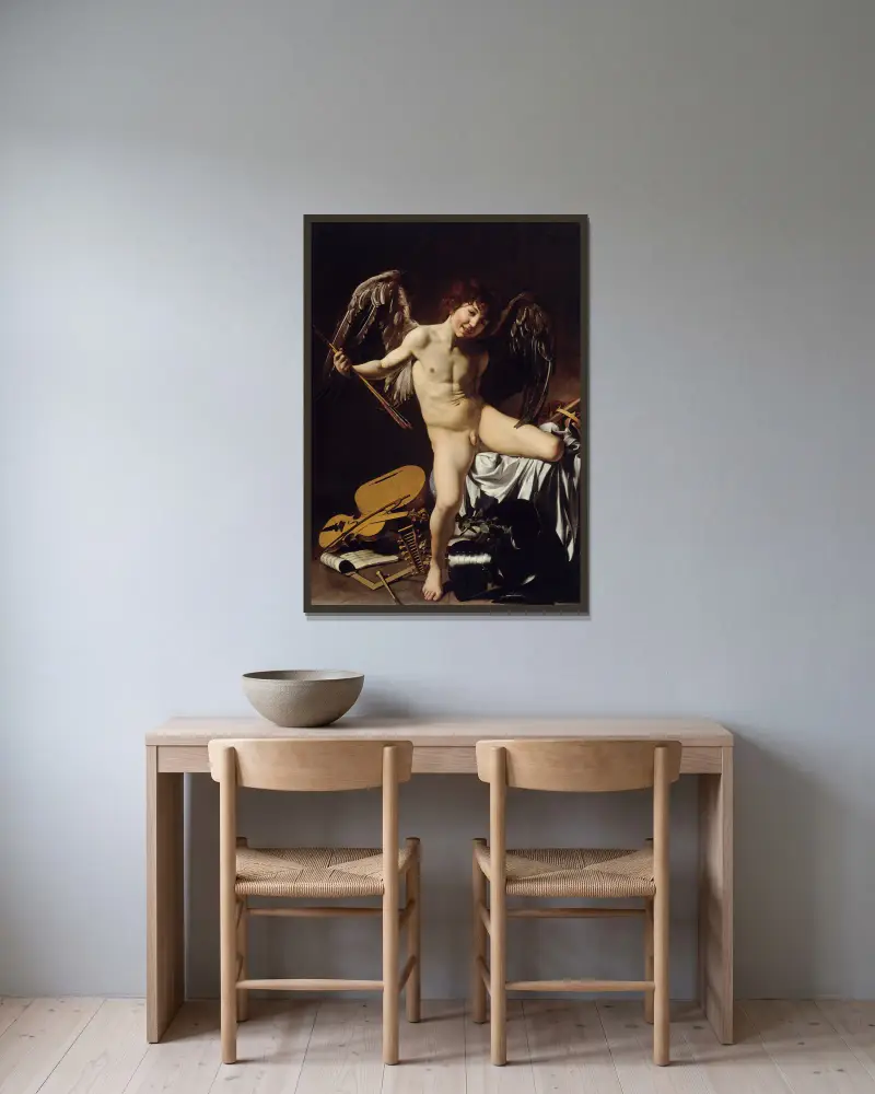 Amor Vincit Omnia av Caravaggio inramad på en vägg