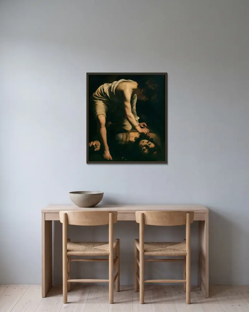David und Goliath von Caravaggio gerahmt an einer Wand