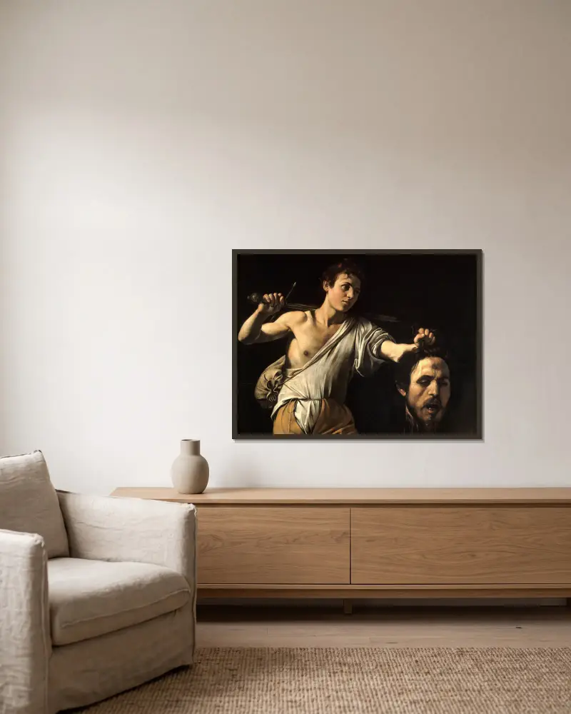 David med Goljats huvud av Caravaggio inramad på en vägg