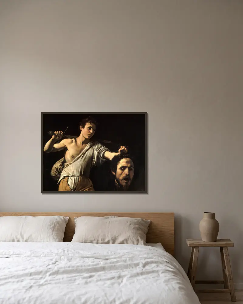 David med Goljats huvud av Caravaggio inramad på en vägg