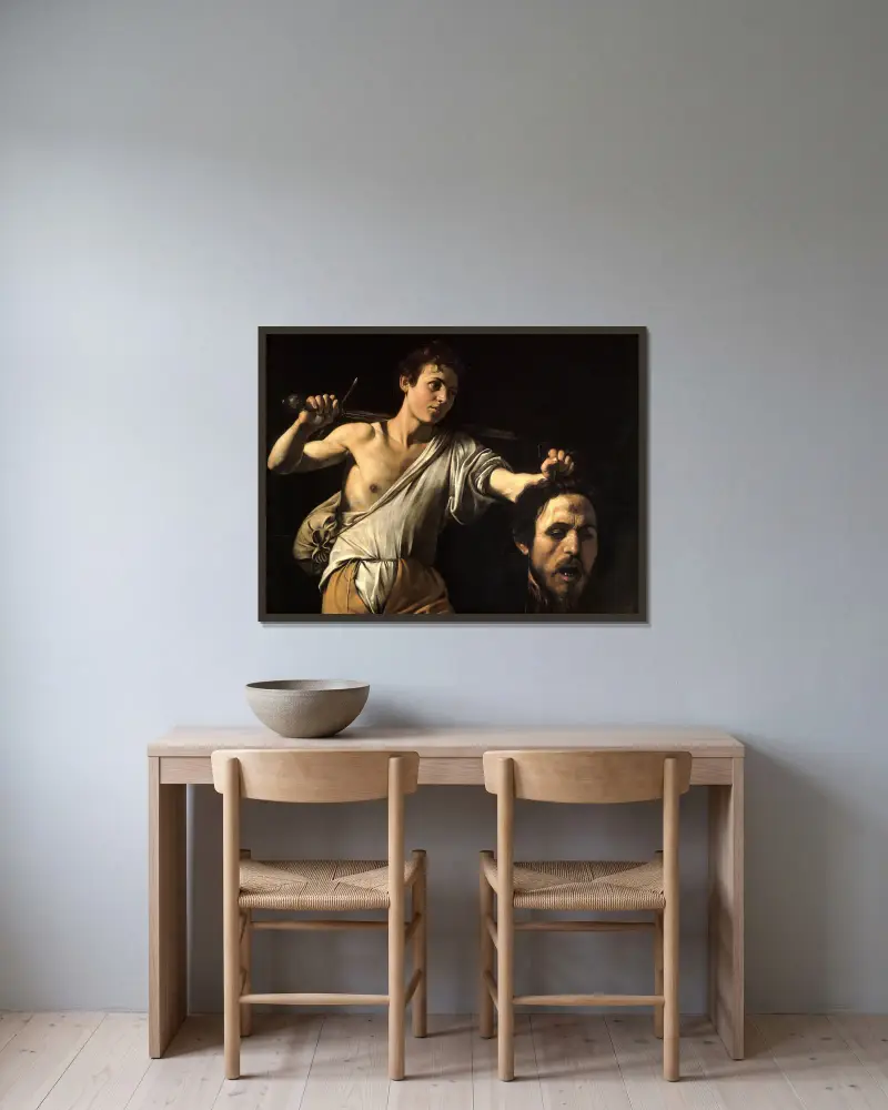 David med Goljats huvud av Caravaggio inramad på en vägg