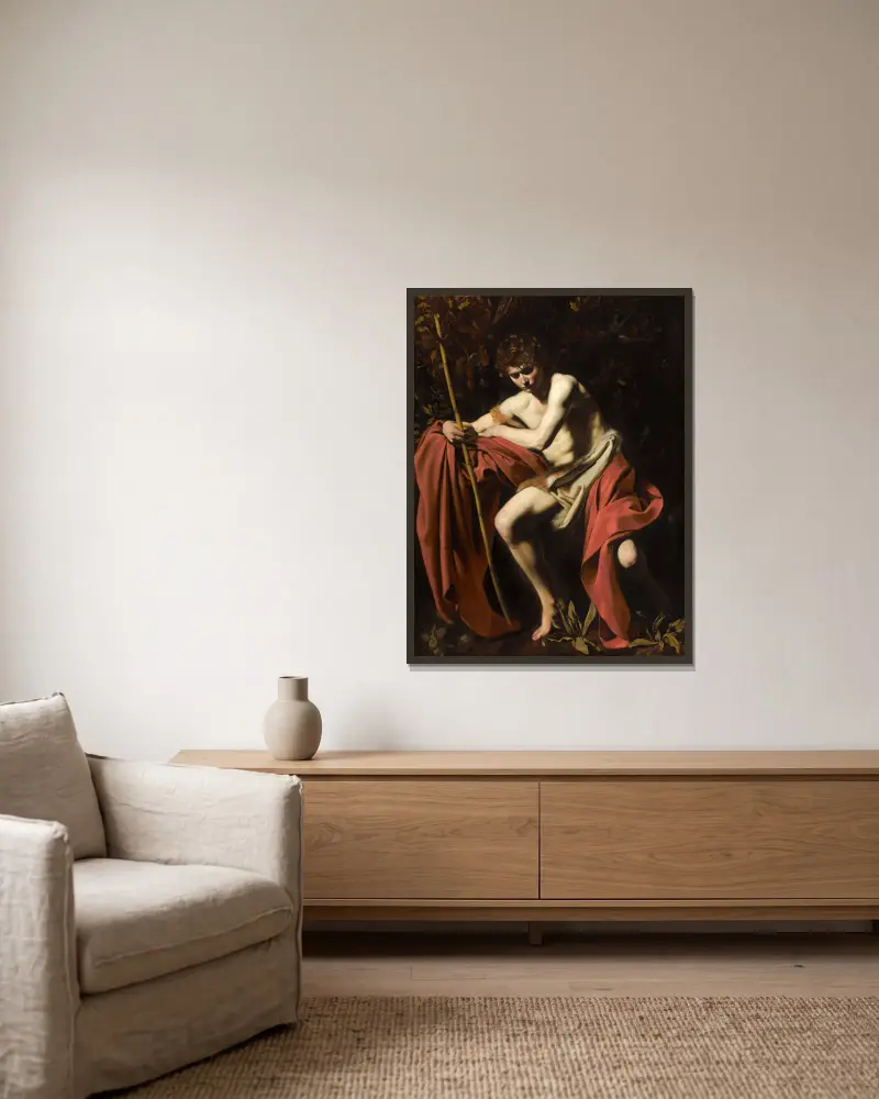 Johannes Döparen i öknen av Caravaggio inramad på en vägg