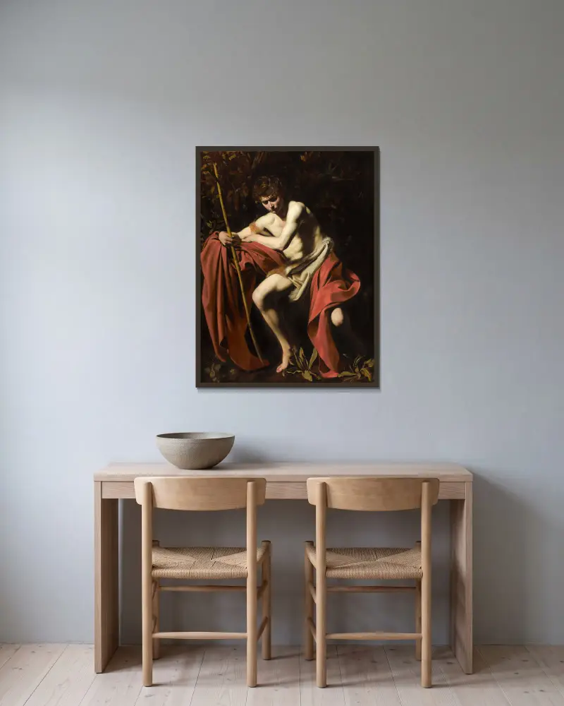 Johannes Döparen i öknen av Caravaggio inramad på en vägg