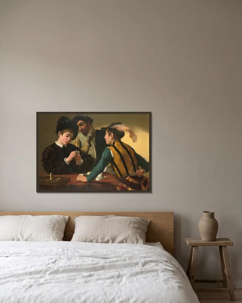 The Cardsharps av Caravaggio inramad på en vägg