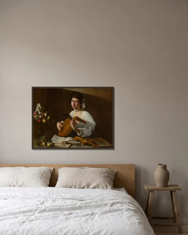 The Lute Player av Caravaggio inramad på en vägg