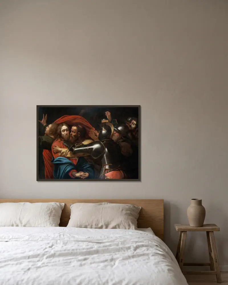 The Taking of Christ av Caravaggio inramad på en vägg