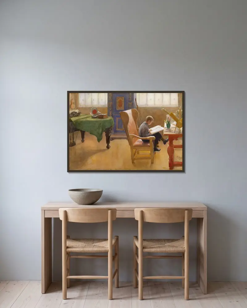 Esbjörn vid skrivbordet av Carl Larsson inramad på en vägg