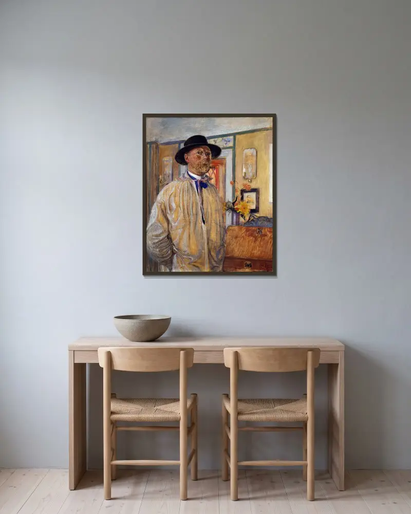 Självporträtt av Carl Larsson inramad på en vägg
