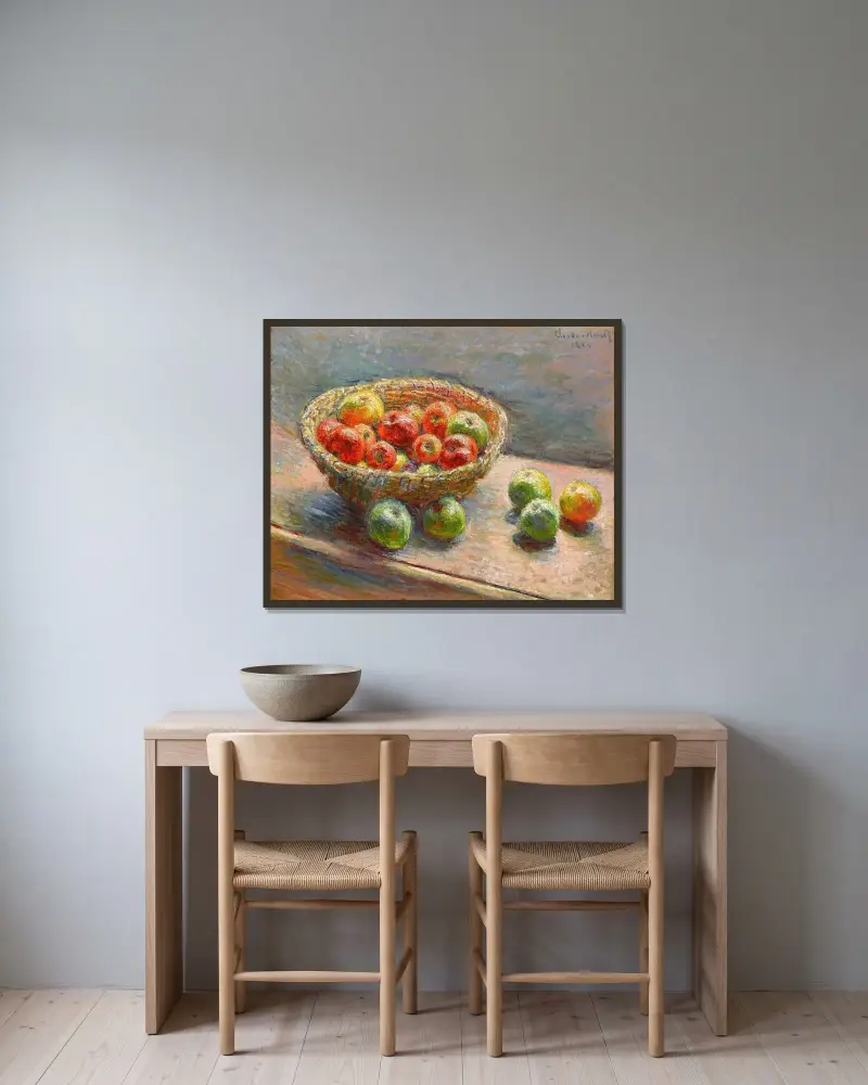 Der Apfelkorb von Claude Monet gerahmt an einer Wand