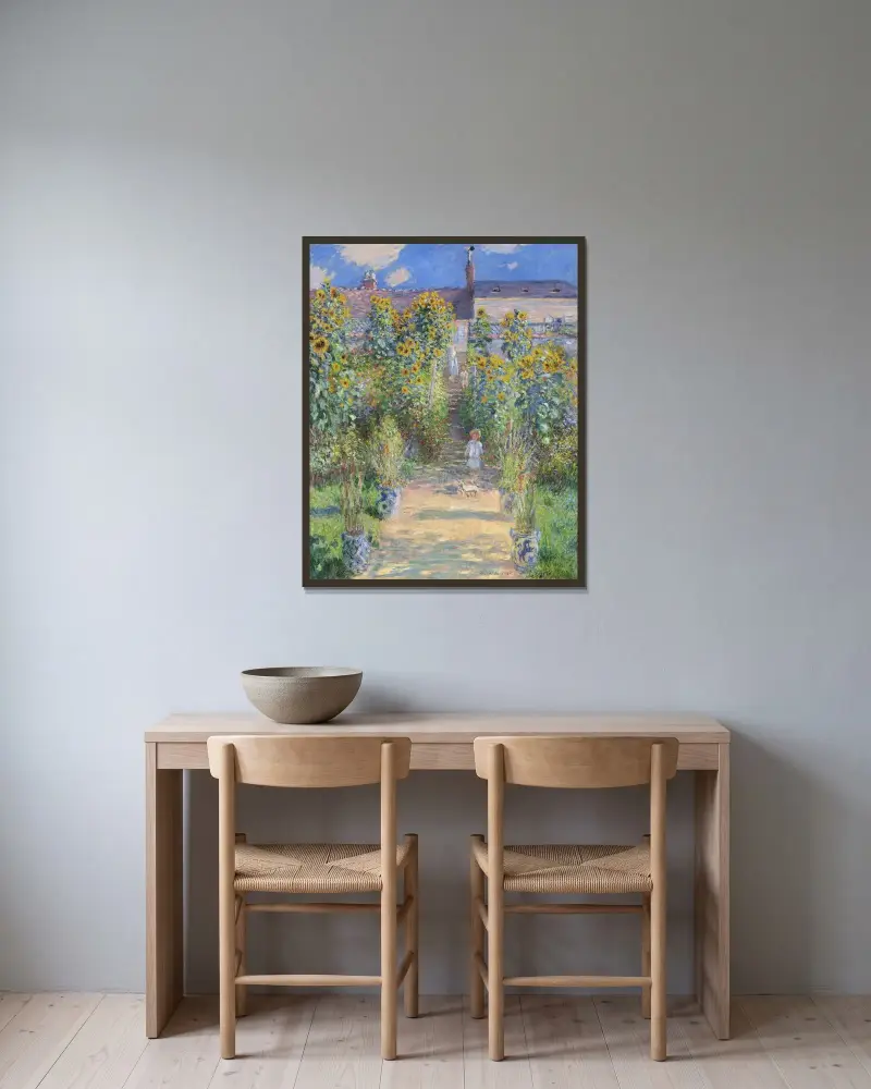 Der Künstlergarten in Vétheuil von Claude Monet gerahmt an einer Wand