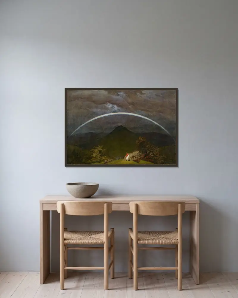 Berglandskap med regnbåge av Caspar David Friedrich inramad på en vägg