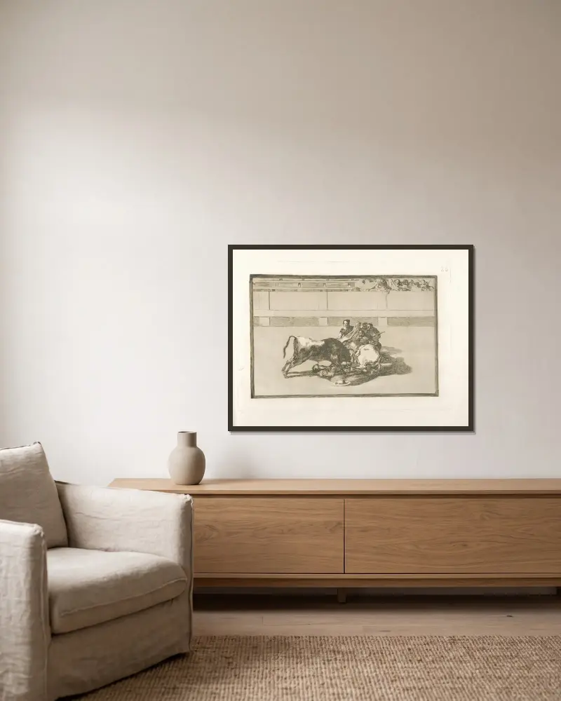 Sturz eines Picadors von seinem Pferd unter dem Stier von Francisco de Goya gerahmt an einer Wand