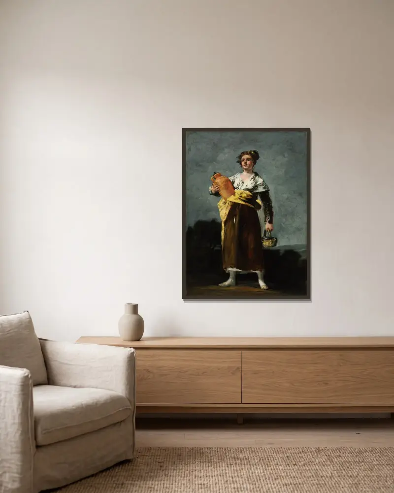 Die Wasserträgerin von Francisco de Goya gerahmt an einer Wand