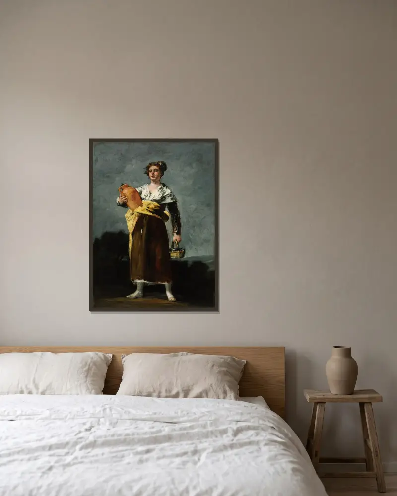 Die Wasserträgerin von Francisco de Goya gerahmt an einer Wand