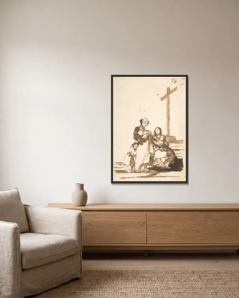 Kvinnor och barn nära ett kors av Francisco de Goya inramad på en vägg