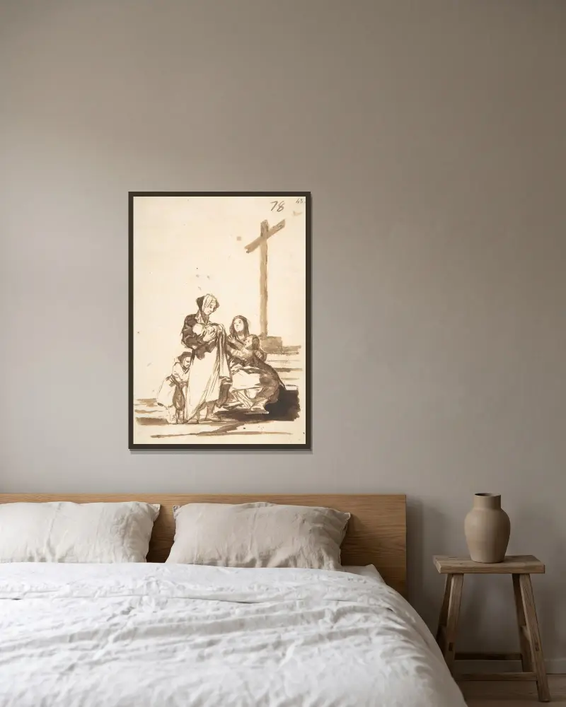 Kvinnor och barn nära ett kors av Francisco de Goya inramad på en vägg
