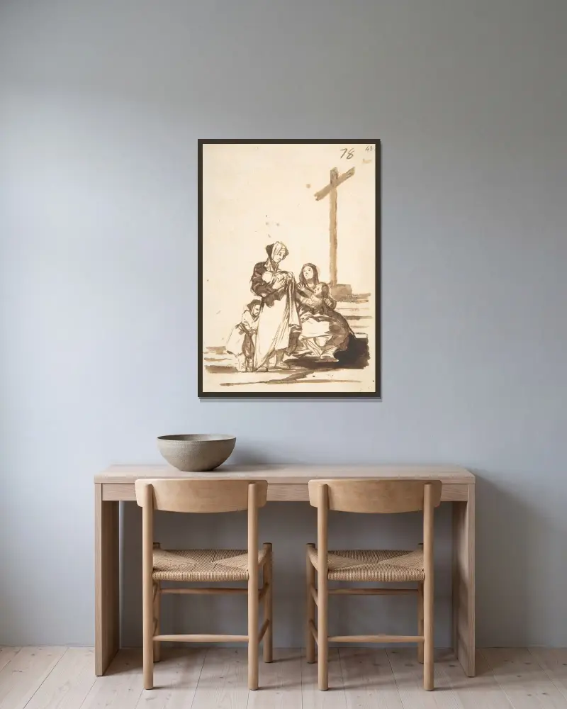 Kvinnor och barn nära ett kors av Francisco de Goya inramad på en vägg