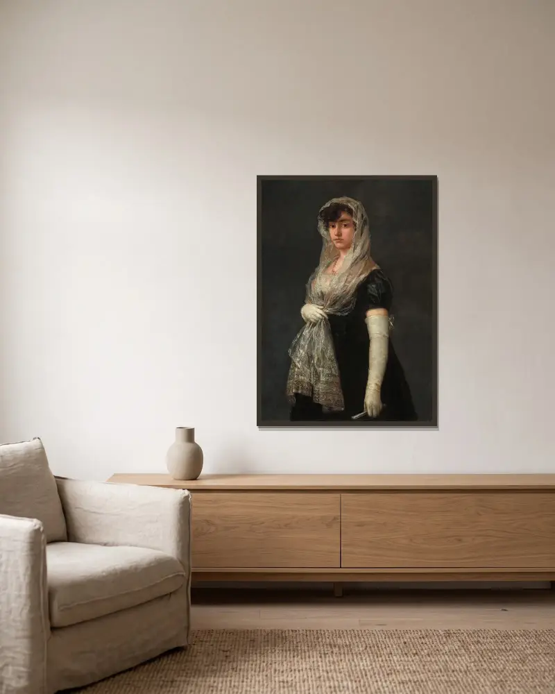 Ung dam med mantilla och basquiña av Francisco de Goya inramad på en vägg
