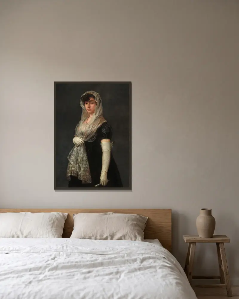 Ung dam med mantilla och basquiña av Francisco de Goya inramad på en vägg