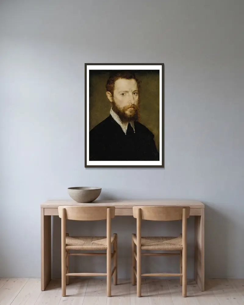 Porträtt av en man med spetskrage av Corneille de Lyon inramad på en vägg