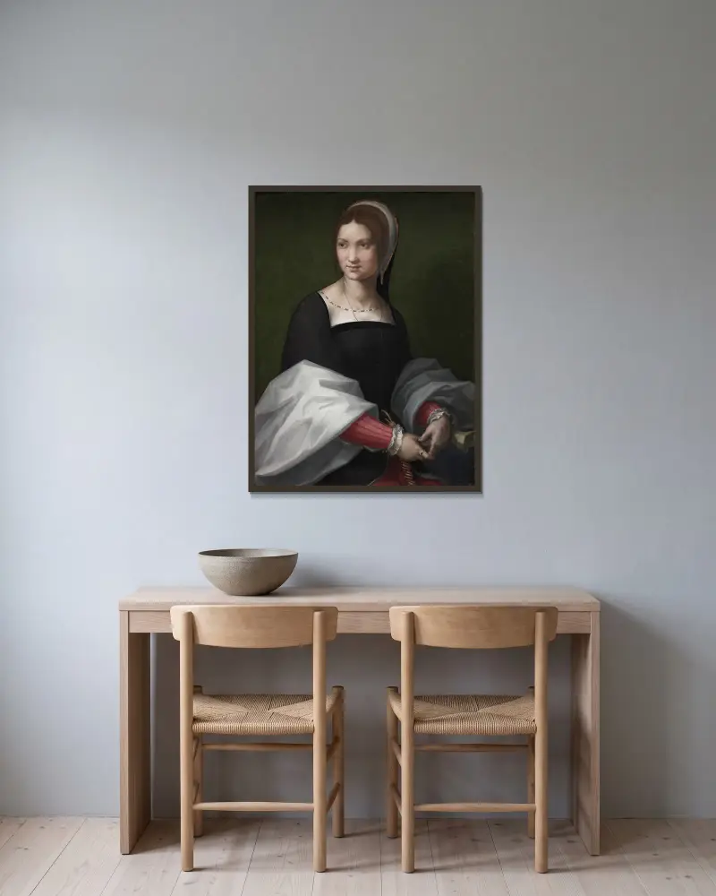 Porträtt av en kvinna av Andrea del Sarto inramad på en vägg
