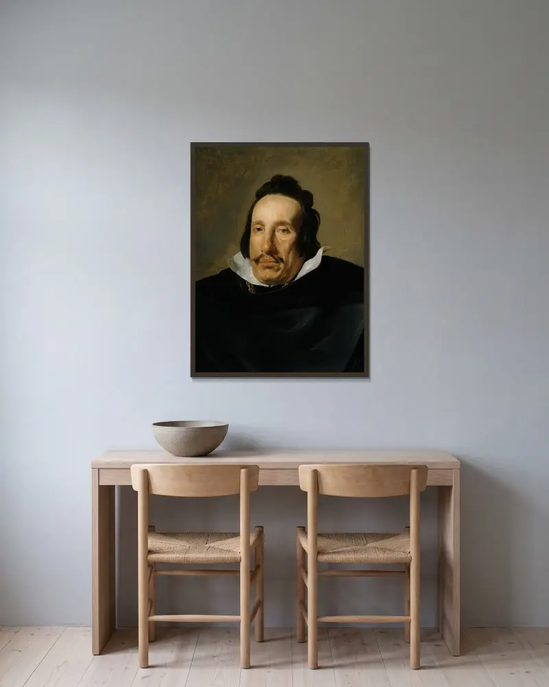 Portrait of a Man av Diego Velázquez inramad på en vägg