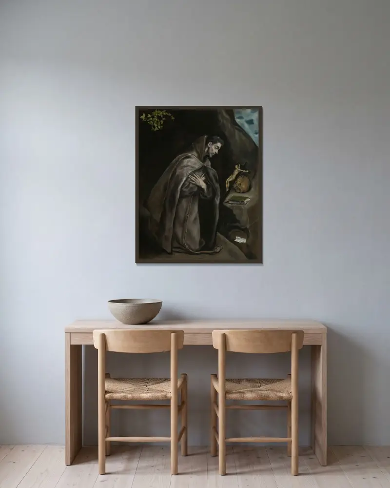 Sankt Franciskus knäböjande i meditation av El Greco (Domenikos Theotokopoulos) inramad på en vägg