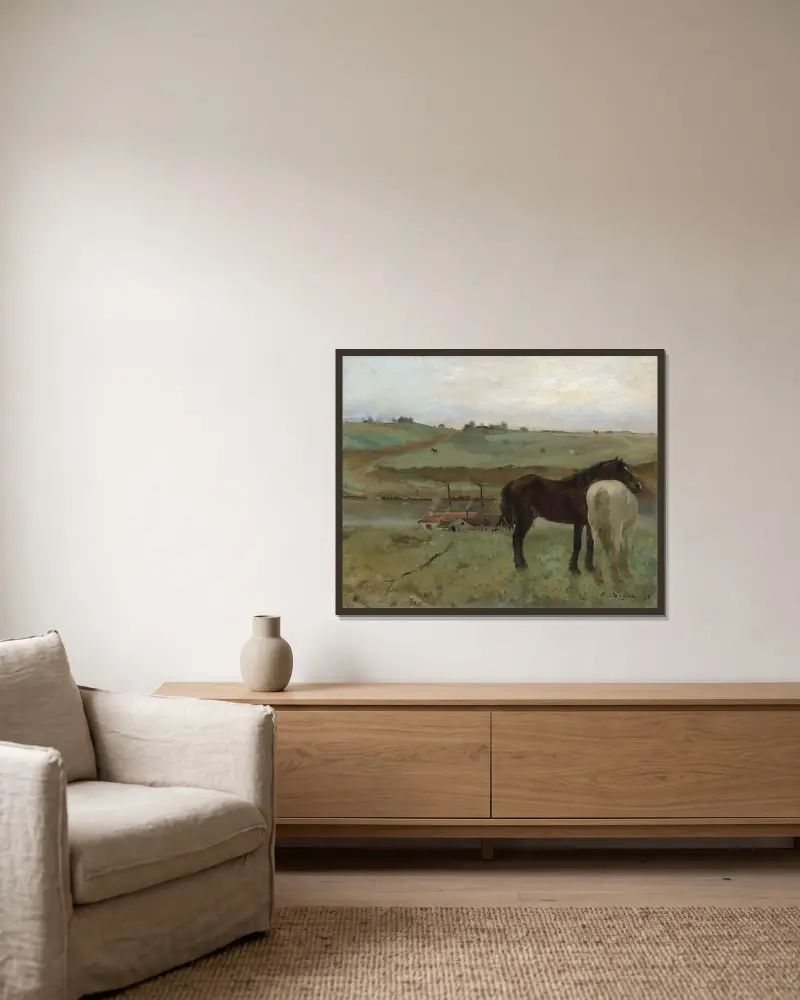 Horses in a Meadow av Edgar Degas inramad på en vägg