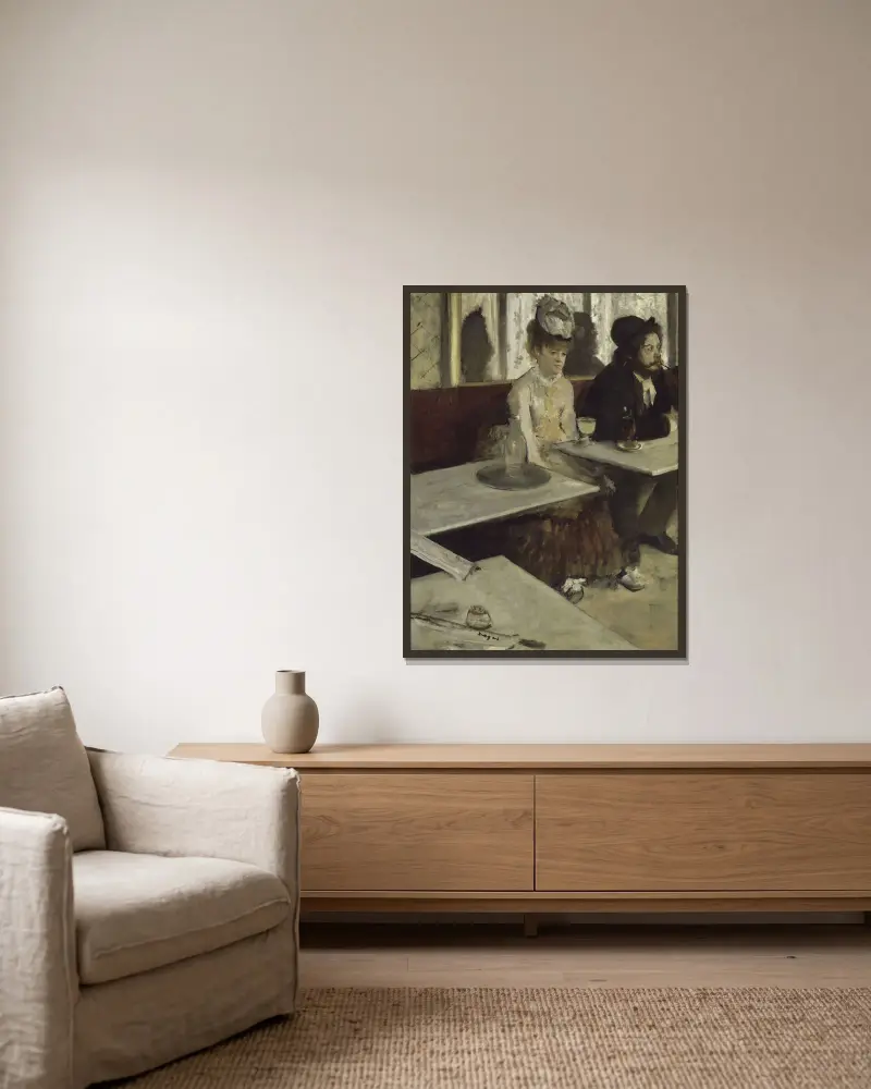 In A Café av Edgar Degas inramad på en vägg