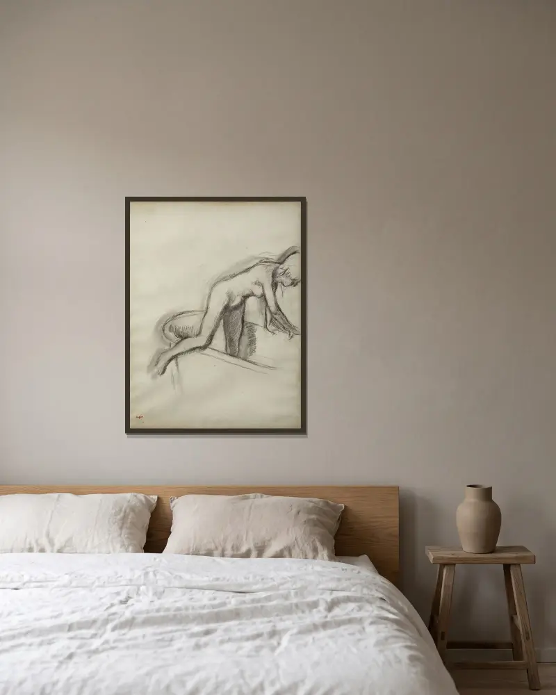 Le Bain av Edgar Degas inramad på en vägg