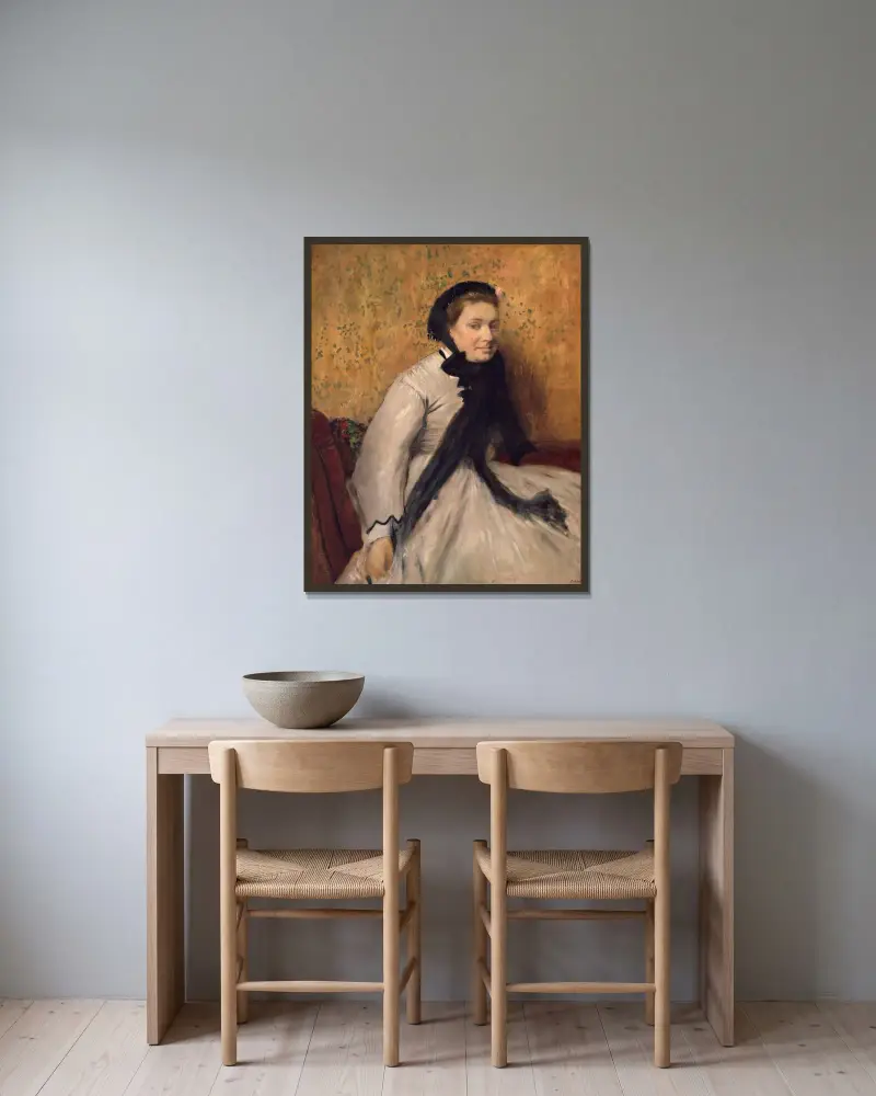 Porträtt av en kvinna i grått av Edgar Degas inramad på en vägg
