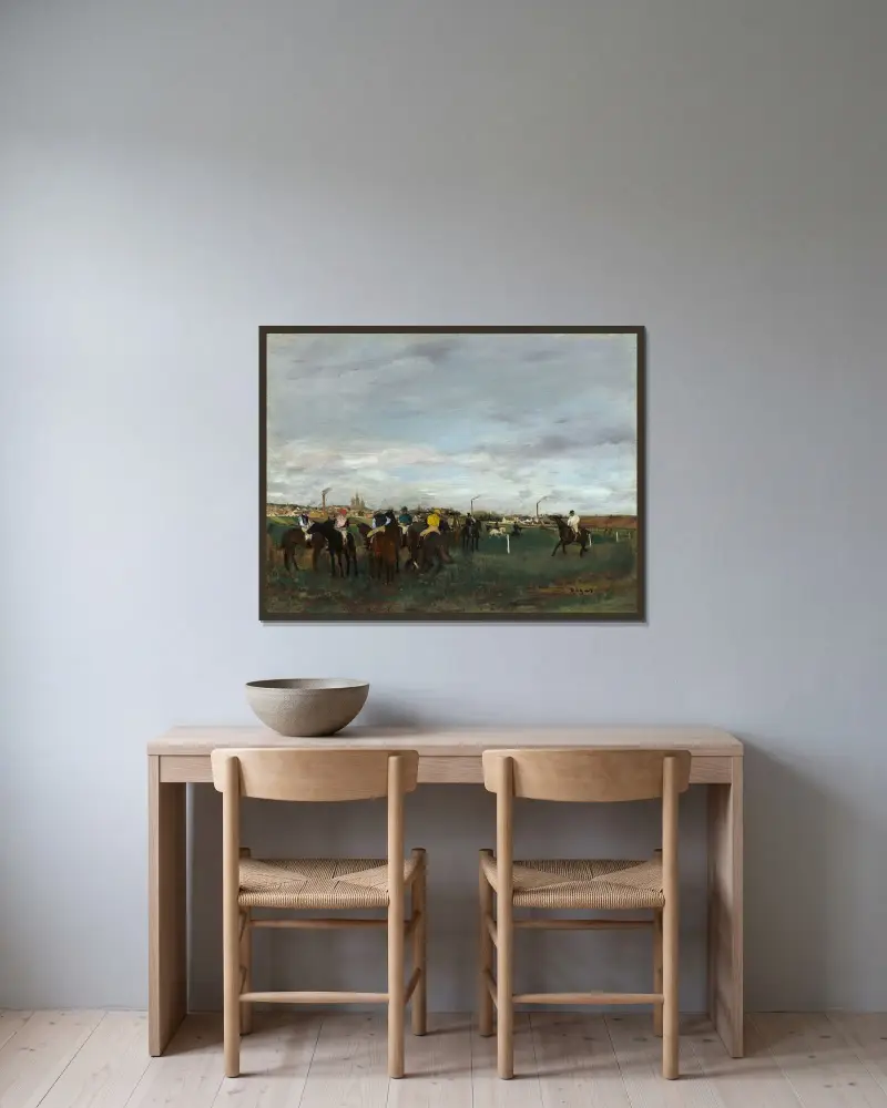 The Races av Edgar Degas inramad på en vägg