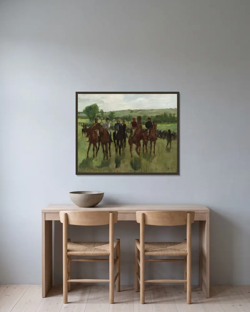 The Riders av Edgar Degas inramad på en vägg