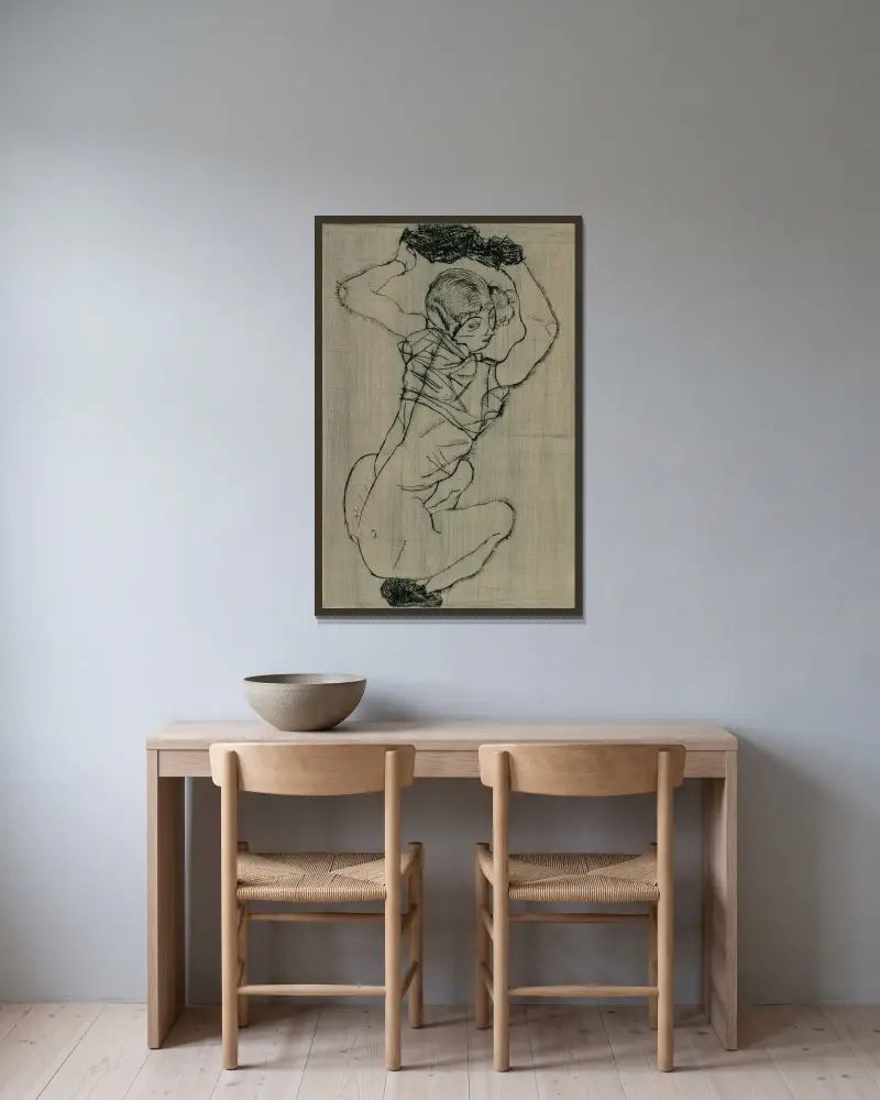 Kauernde av Egon Schiele inramad på en vägg