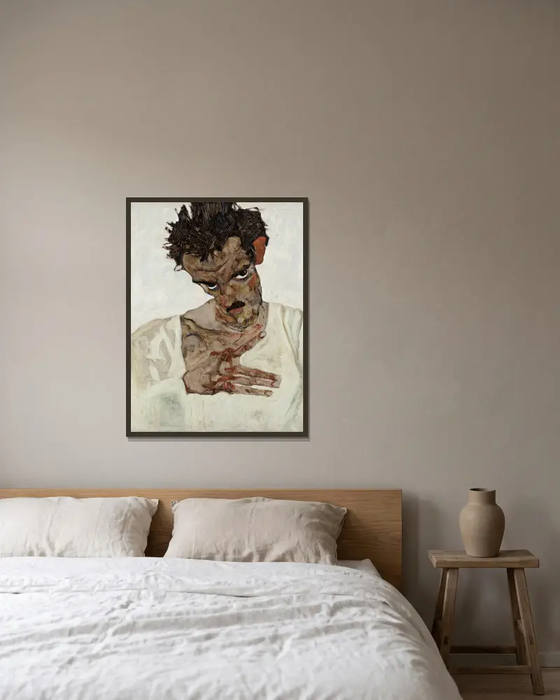 Self-Portrait With Lowered Head av Egon Schiele inramad på en vägg