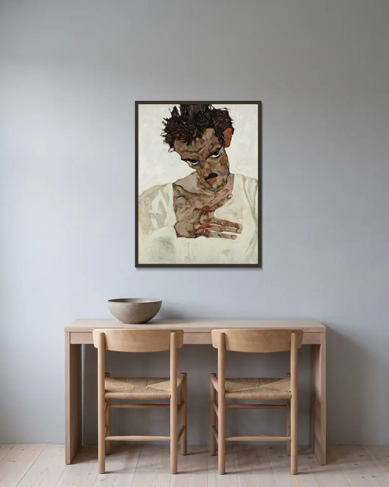 Self-Portrait With Lowered Head av Egon Schiele inramad på en vägg