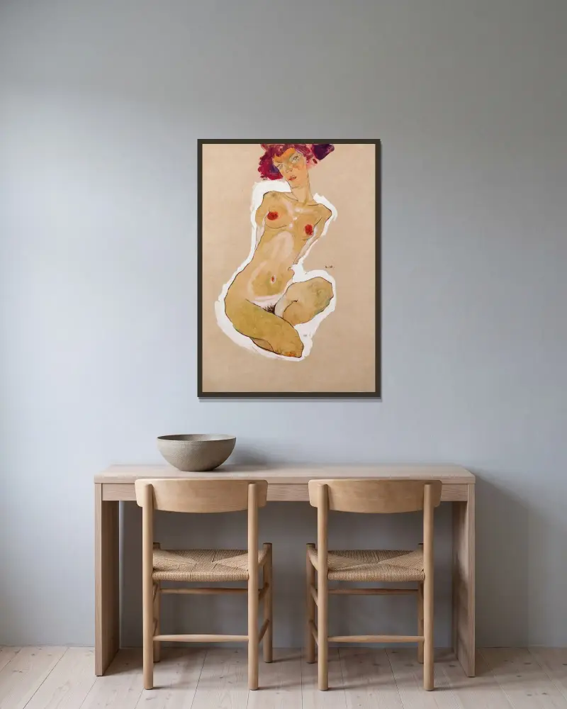 Squatting Female Nude av Egon Schiele inramad på en vägg